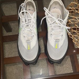 Nike Light Gray Flyknit Sneakers with Neon Yellow Swoosh